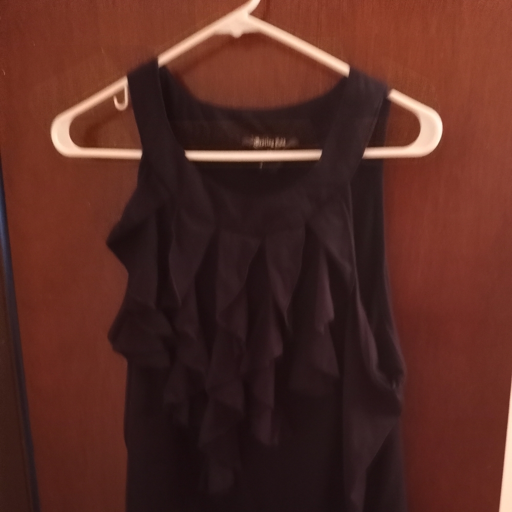 Ruffled front sleeveless shirt